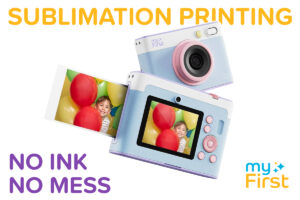An instant print camera printing a photo, labeled "sublimation printing" and "no ink, no mess," against a white background.